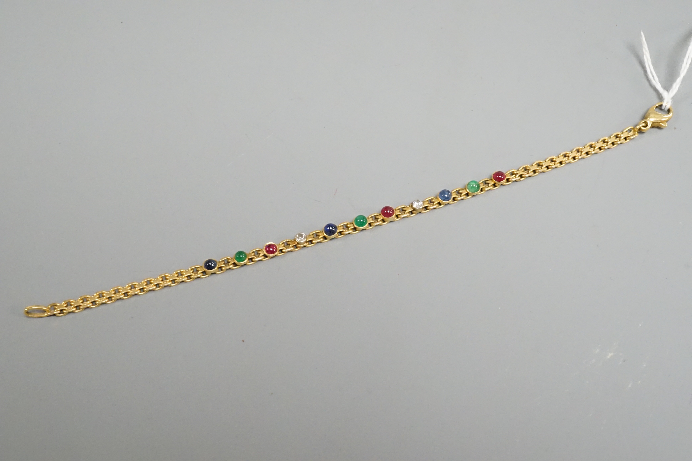A modern yellow metal, diamond and cabochon gem set bracelet, 17.5cm, gross weight 9.6 grams.